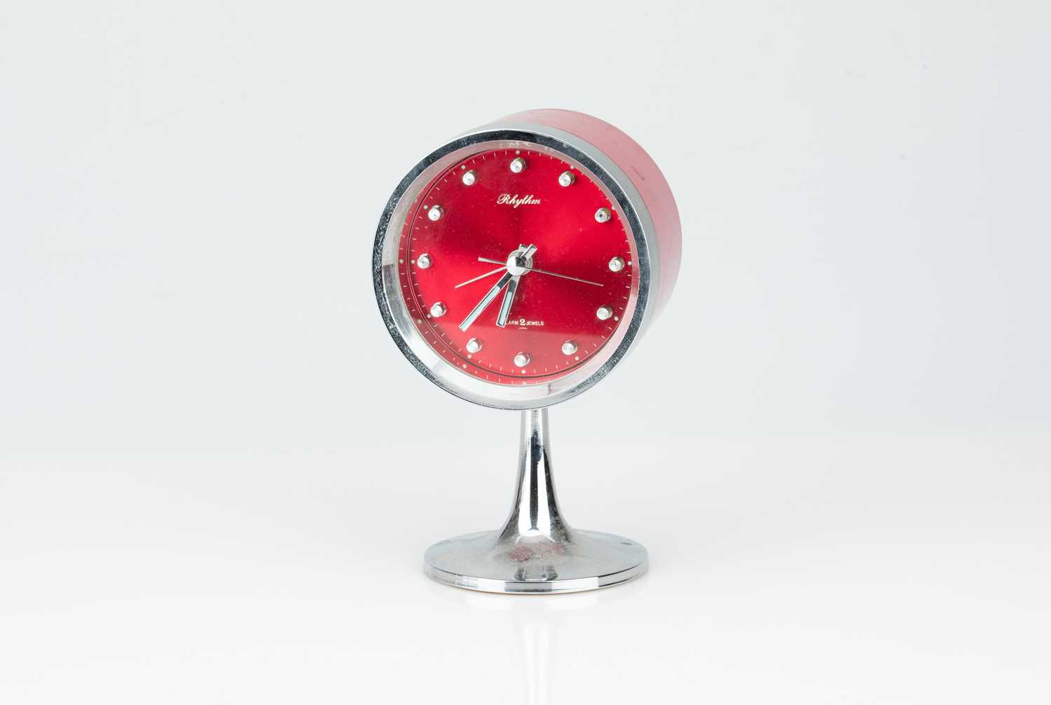 Lot 15 - A 1970s Retro Rhythm Drum-Shaped Two Jewel Alarm Clock