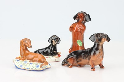 Lot 36 - A Basil Matthews Animalier Group of  a Dachshund on Cushion