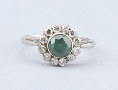 Lot 140 - An Art Deco Diamond and Emerald Platinum Cluster Ring