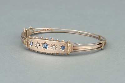Lot 8 - 9 ct Gold Cornflower Sapphire and Diamond Bangle