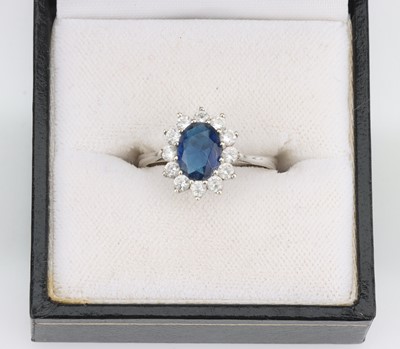 Lot 38 - A 9 ct White Gold Sapphire Cluster Ring