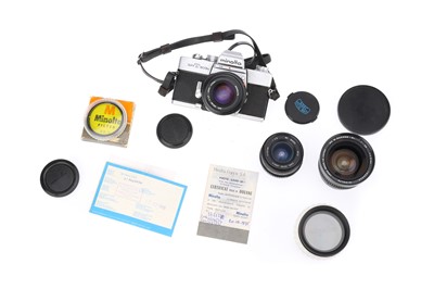 Lot 180 - A Minolta SRT 303b 35mm SLR Camera Outfit