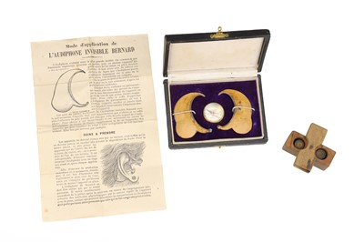 Lot 152 - Quack Hearing Aids, Audiphone Invisible Bernard, and military ear plugs