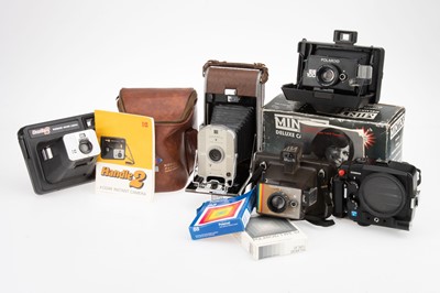 Lot 305 - A Group of Instant Film Cameras