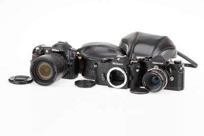 Lot 31 - Three Nikon SLR Cameras