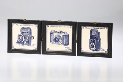 Lot 455 - Three Ceramic Tiles Decorated with Popular Cameras