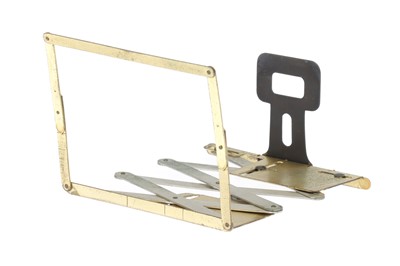 Lot 551 - A James A. Sinclair Brass "Scissors" Accessory Frame Finder