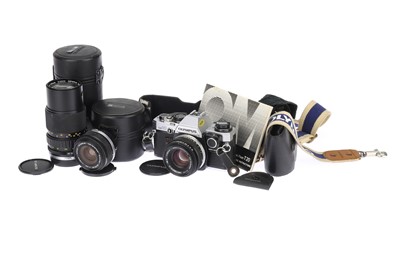 Lot 105 - An Olympus OM10 35mm SLR Camera Outfit