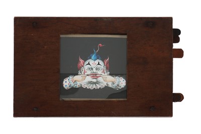 Lot 209 - A Complex Magic Lantern Slide of a Clowns Face