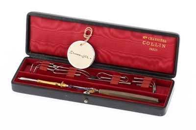 Lot 9 - A Wire Needle Holder and Needle Set