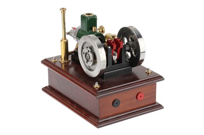 Lot 194 - the engine with mounted on a polished oak base,...
