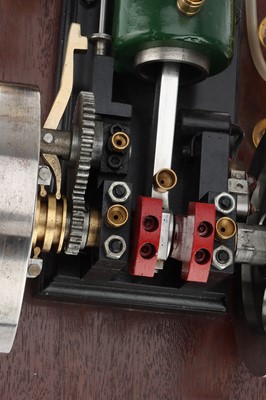 Lot 194 - the engine with mounted on a polished oak base,...
