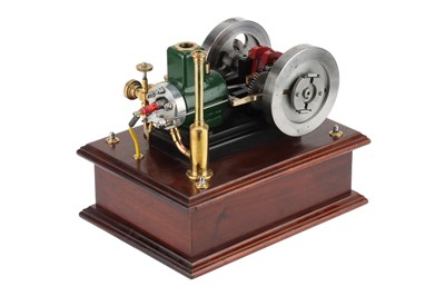 Lot 194 - the engine with mounted on a polished oak base,...