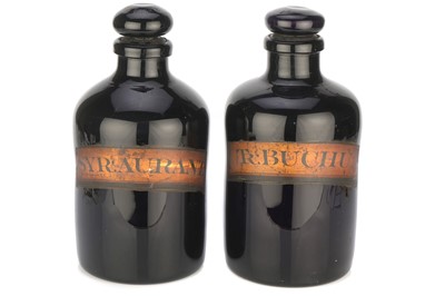 Lot 417 - A Pair of Amethyst Glass Apothecary Bottles