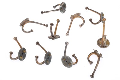 Lot 446 - A Collection of 10 Art & Crafts Brass Coat Hooks