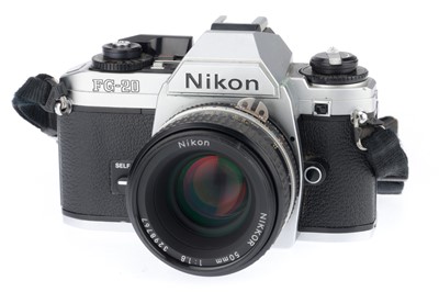 Lot 26 - A Nikon FG-20 35mm SLR Camera Outfit
