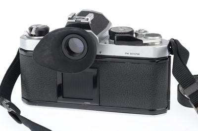 Lot 27 - A Nikon FM 35mm SLR Camera Outfit