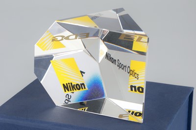 Lot 557 - A Nikon Branded Prism Paperweight