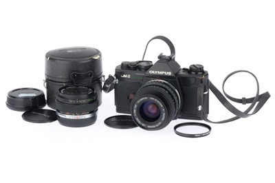 Lot 186 - An Olympus OM-2 Spot Program slr Camera Outfit