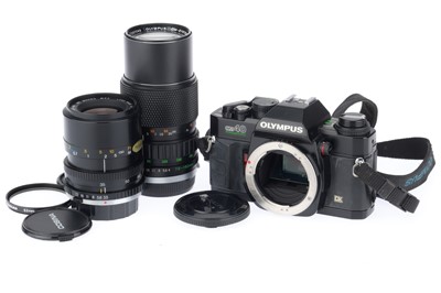 Lot 209 - An Olympus OM40 SLR Camera Outfit