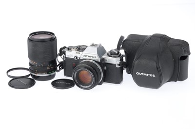 Lot 210 - An Olympus OM10 SLR Camera Outfit