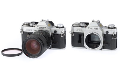 Lot 210 - A Pair of Canon AE-1 SLR Cameras