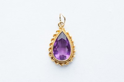 Lot 1 - A 9ct Yellow Gold Pear Cut  Amethyst Pendant