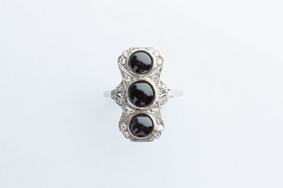 Lot 4 - A Platinum Diamond & Onyx Ring