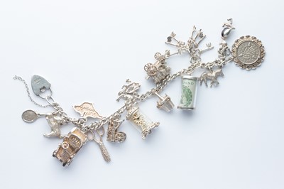 Lot 40 - A Silver & White Metal Charm Bracelet