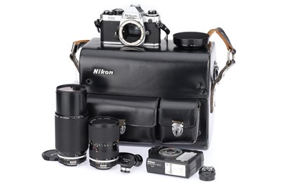 Lot 46 - A Nikon FE2 35mm SLR Camera Outfit.