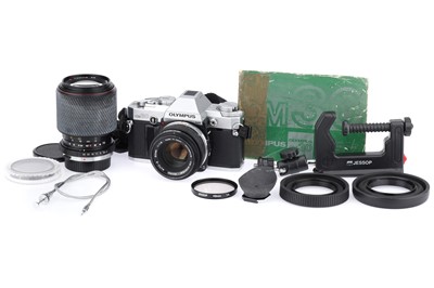 Lot 132 - An Olympus OM30 35mm SLR Camera