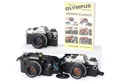 Lot 328 - Three Olympus OM Series 35mm SLR Cameras