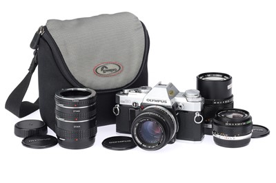 Lot 329 - An Olympus OM30 35mm SLR Camera Outfit