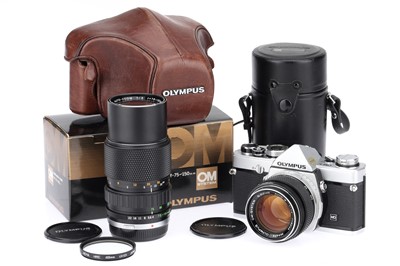 Lot 207 - An Olympus OM-1N 35mm SLR Camera Outfit
