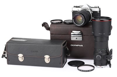 Lot 209 - An Olympus OM1 35mm SLR Camera Outfit