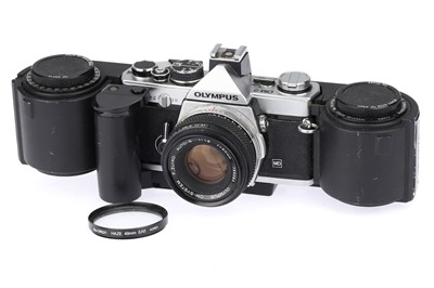Lot 162 - An Olympus OM-2 35mm SLR Camera & 250 Exposure Back
