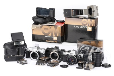 Lot 127 - A Group of Olympus OM SLR Cameras and Accessories