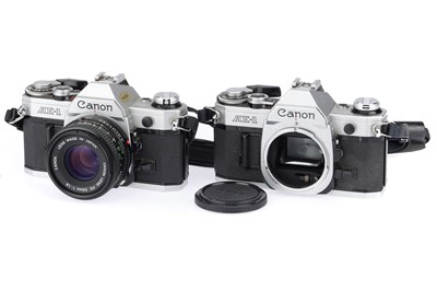 Lot 120 - A Pair of Canon AE-1 35mm SLR Cameras
