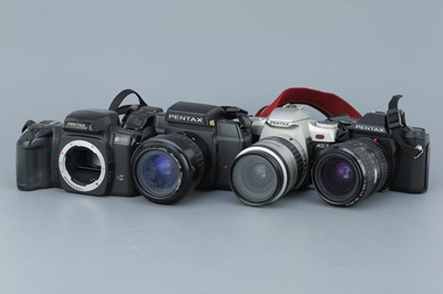 Lot 321 - Four Pentax SLR Cameras