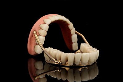Lot 131 - A Complete Set of Gold & Porcelain Sprung Dentures